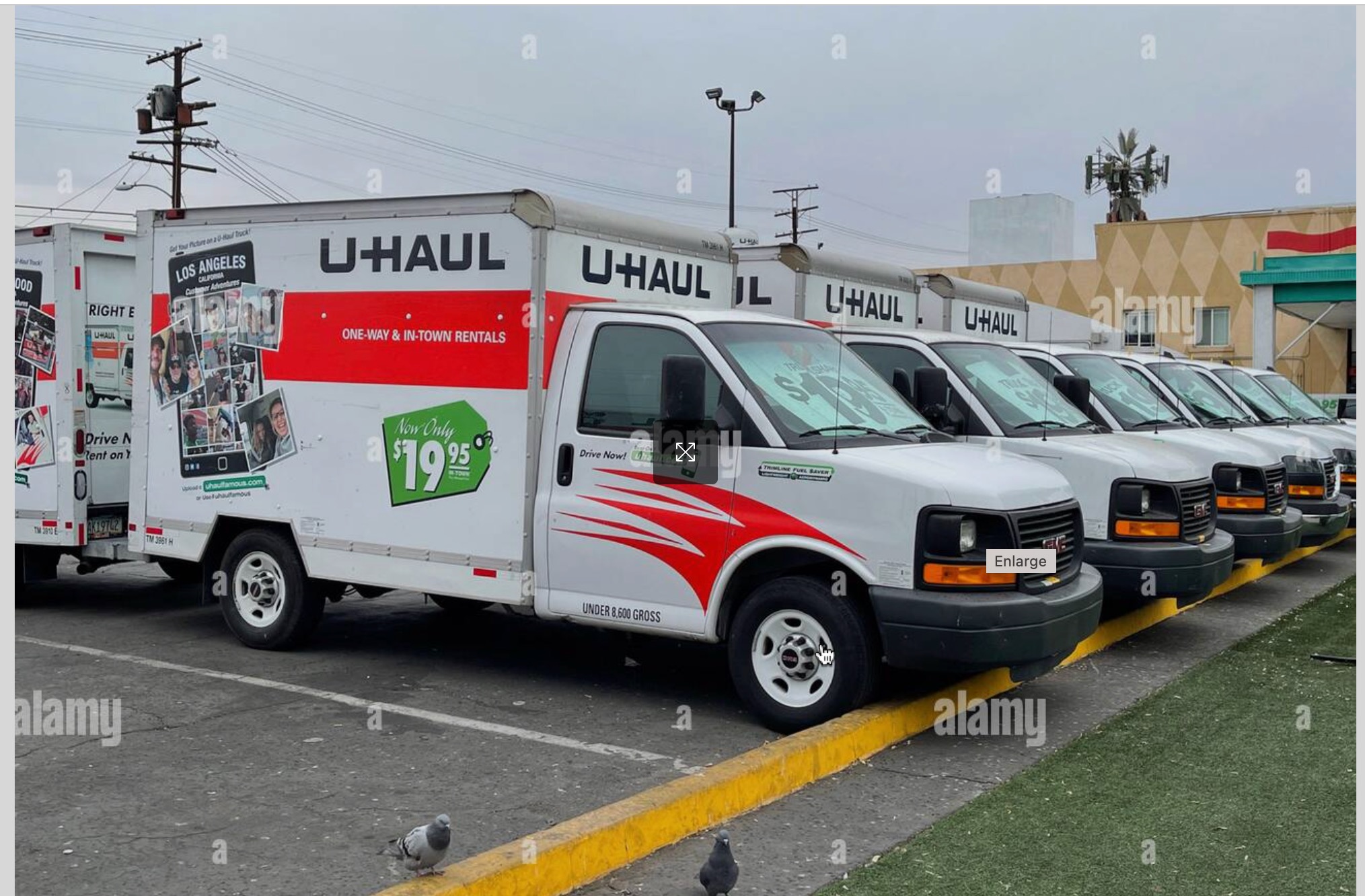 Car towing an enclosed trailer for small item moving in British Columbia